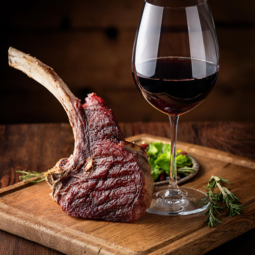 Red Wine Paired with Tomahawk Steak